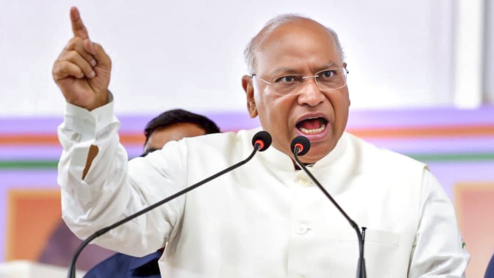 Kharge speaking passionately at a rally, emphasizing the need to protect constitutional rights secured by.