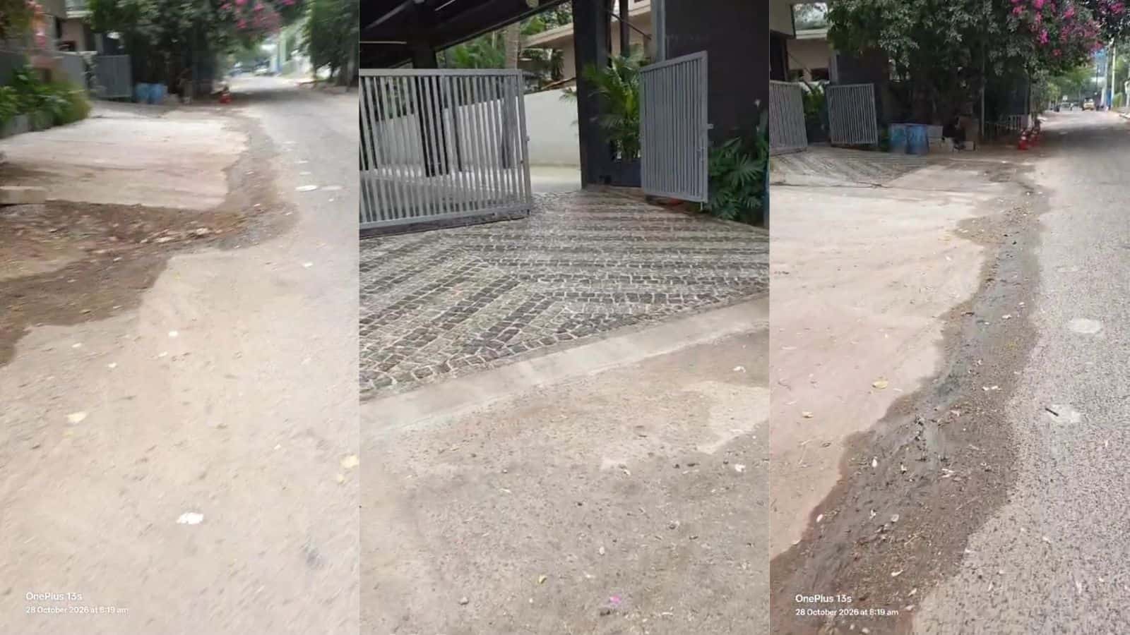 Paved and uneven roadside with a gated entrance and surrounding residential area.