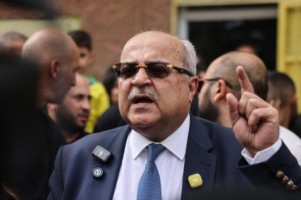 Ahmad Tibi speaks to reporters during a public appearance.